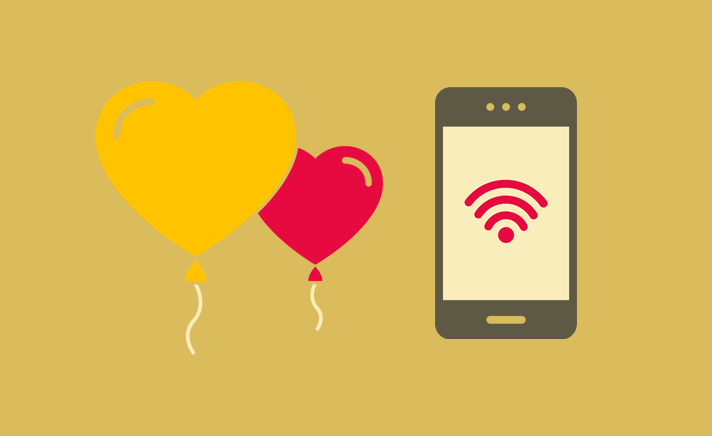 balloons and phone with wifi symbol