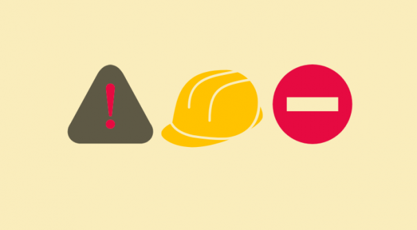 hazard symbols and hard yellow hat