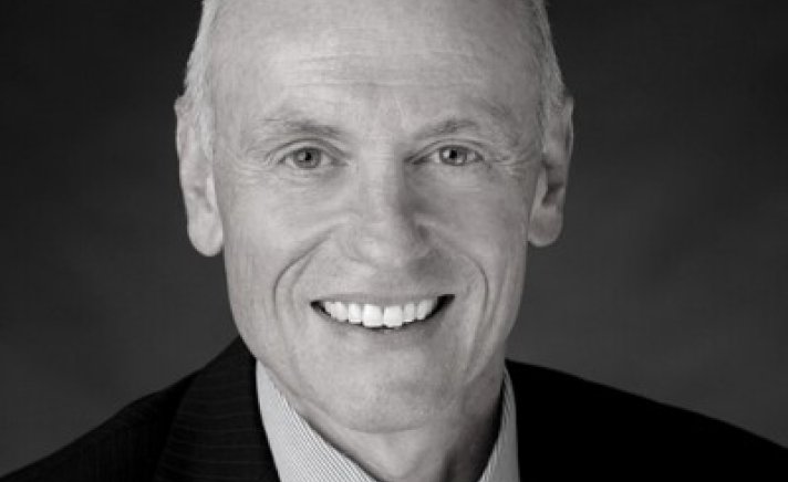 Black and white photo of smiling man